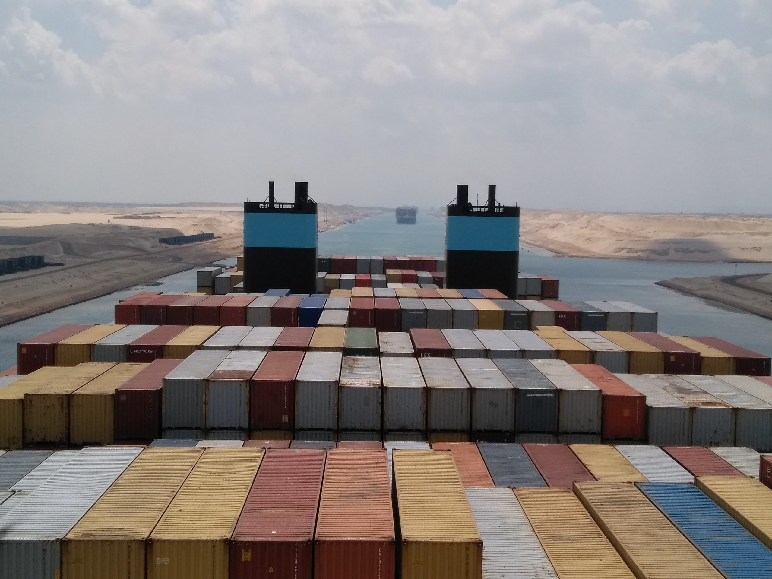 PIC: Passing between the hot desert sands of the Suez Canal, Egypt