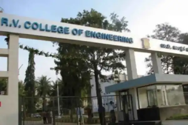 Featured image showing the best engineering colleges in Bangalore with skyline, engineering icons, and text highlighting rankings, placements, and courses.. Main campus buildings of RV College of Engineering in Bengaluru.