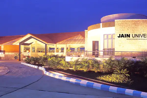 Jain University campus in Bengaluru with modern academic buildings and students on campus